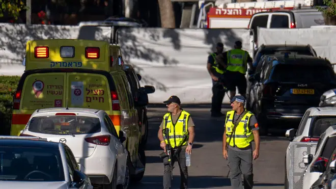 Israeli security forces secure a road near where Israel's government says a drone launched toward Israeli Prime Minister Benjamin Netanyahu's house in Caesarea