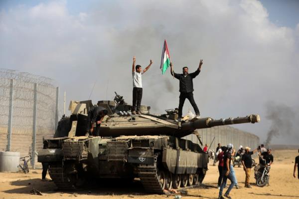 Hamas militants on top of Israeli tank
