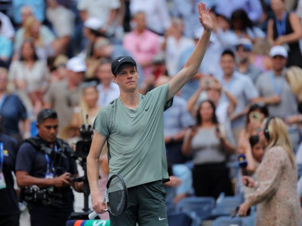 Italy's Jannik Sinner celebrates winning his first round match against Mackenzie McDonald of the U.S.